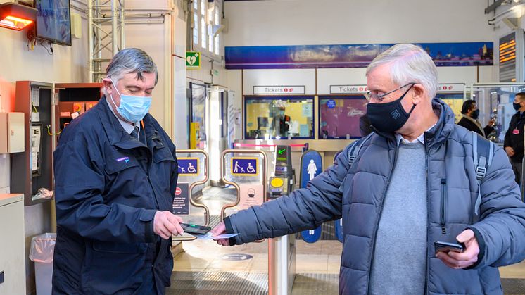 Neil Middleton, of Rail Future Hertfordshire and Bedfordshire, has his key smartcard checked at Hitchin station
