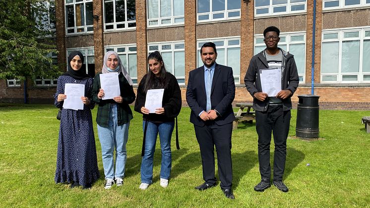 Celebration day – Cllr Tamoor Tariq meets students at his former school, The Derby High in Bury.