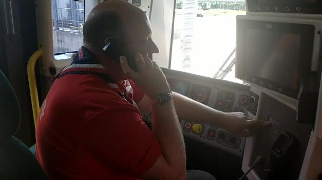 Andrew Bolton records an announcement on a Southern train
