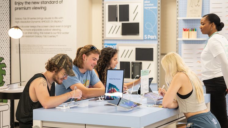 Consumers interacting with TabS9 at NY store