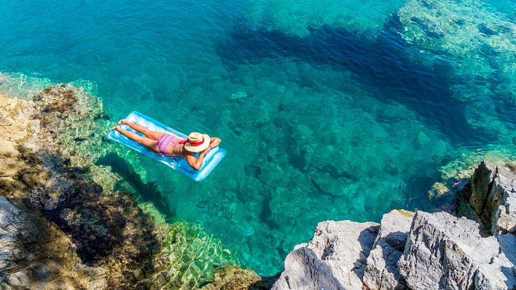 Woman-floating-sea-ocean-1046570642 (1).jpg
