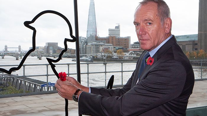 CEO Patrick Verwer places a poppy on a 'There But Not There' outline of a soldier from the First World War at London Blackfriars. GTR hosted events to mark the 100th anniversary of Armistice at stations across its network
