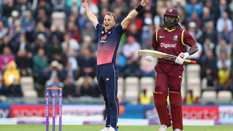 Tom Curran celebrates taking Chris Gayle's wicket on his ODI debut at Southampton earlier this summer. Credit Getty Images/Michael Steele