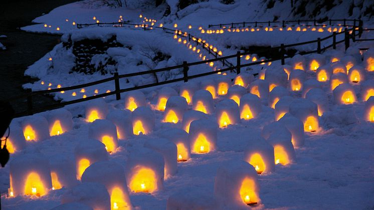 Snow Huts at Yunishigawa Onsen Aglow Past Dusk