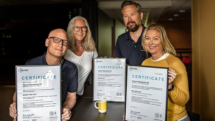 Proud: HSEQ Coordinator Ingunn Stensgård and CEO Stian Martinsen (in the back), Team leader Digital Lars Bratli and Head of communications, HR & ESG Eva Nordskog is proud to have achieved 3 ISO certifications. Photo: Heidi S. Middleton.