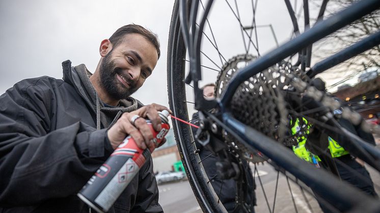 Mechanic Ethan Masih servicing a bike
