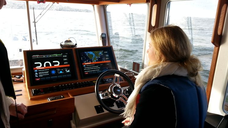The picture above shows one of the students trying her hand at driving a boat using a joystick (to her right and not visible in the picture).