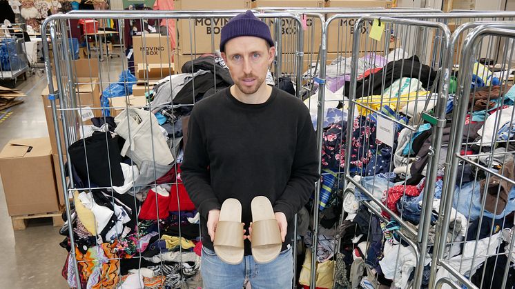 Designer Chris Margetts with the unique 3D-printed shoes made from recycled textiles.