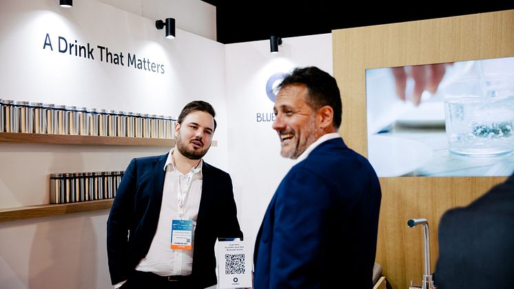 Bluewater booth at Cop28, enjoying a laugh