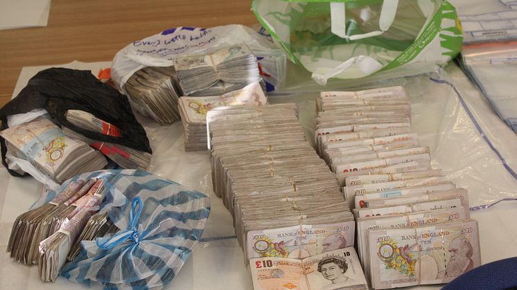 £15m fraud gang jailed - £98,990 of the seized cash