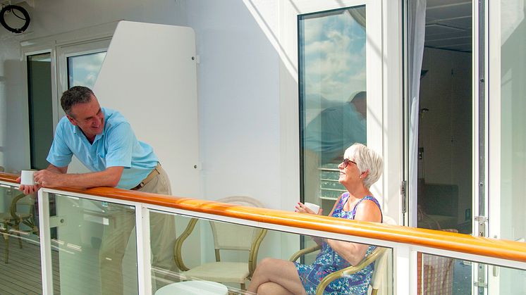 Couple sitting out on Room Balcony 