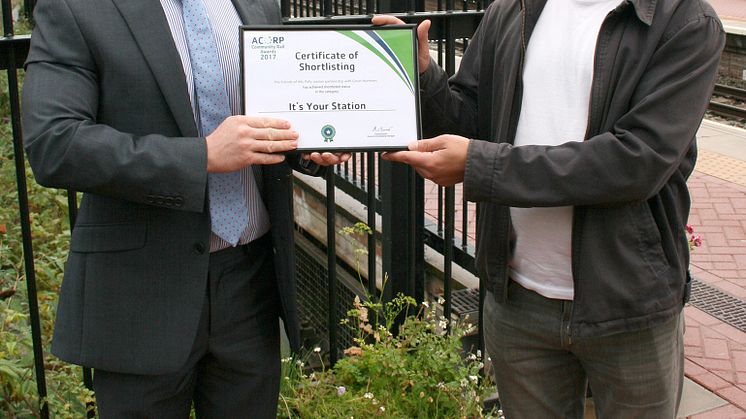 Winning smiles: Great Northern's Alexandra Palace Station Manager Martin Brown (left) presents Michael Solomon Williams with his certificate  High res version attached