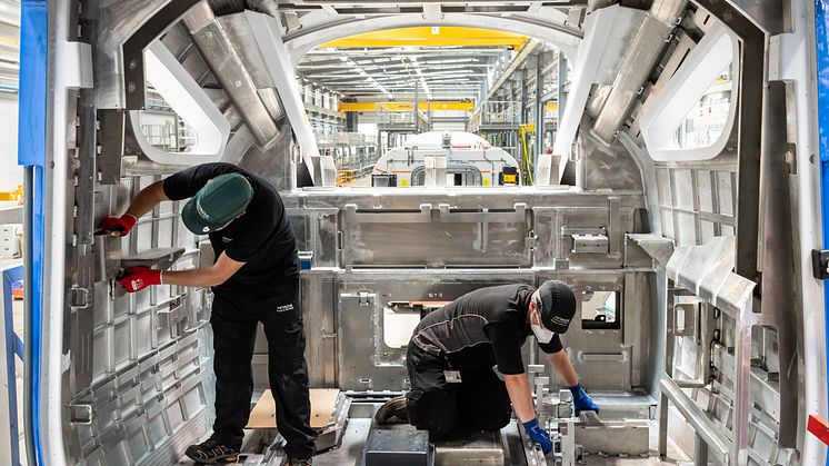 Hitachi production team wear appropriate PPE when manufacturing in Newton Aycliffe