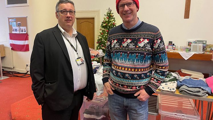 Pictured (from right) Paul shows Cllr Gold around the food club and the clothes shop