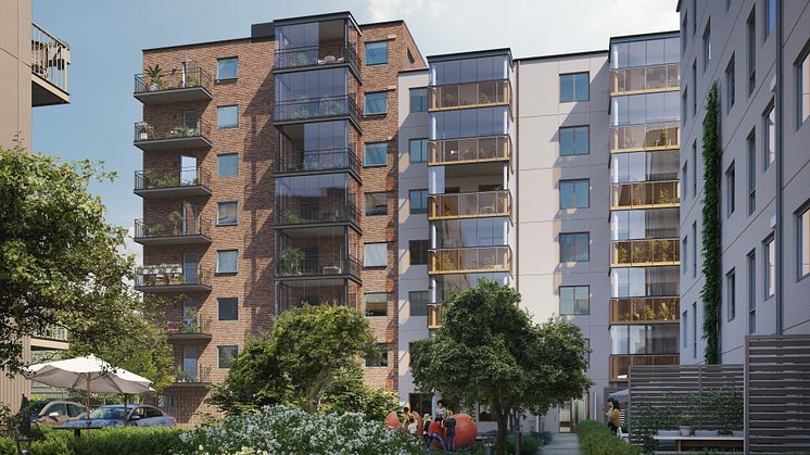 Innergården med lekplats och röda klätteräpplen. Visionsbild: HP Boendeutveckling.