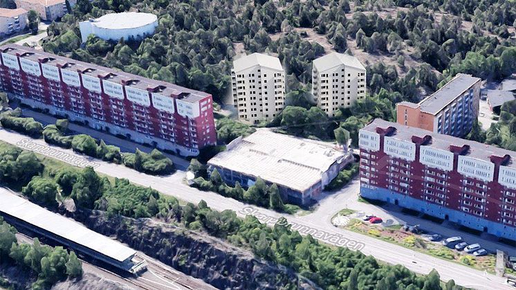 Bilden är en skiss av hur de föreslagna punkthusen (de vita husen i mitten) kan placeras i förhållande till SKBs nuvarande kvarter. Bild: ZIN Arkitektur