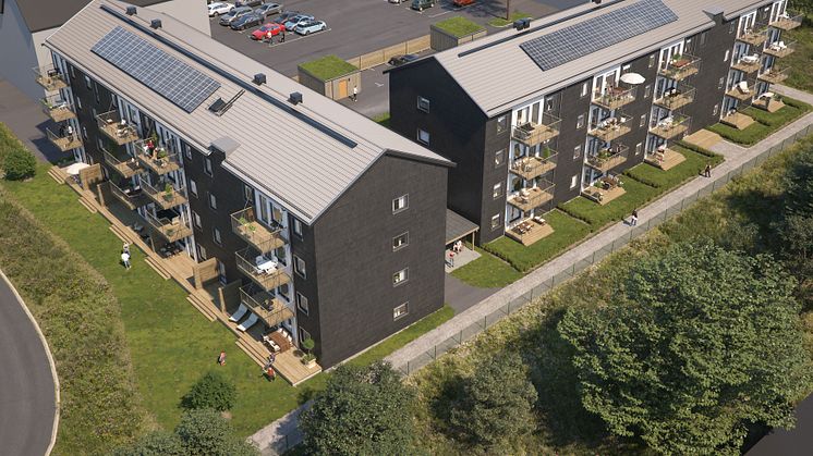 Översiktsillustration av de nya husen i kvarteret BoKlok Staben, Karlskrona. På taken syns solceller som skapar energi till fastighetsel. 