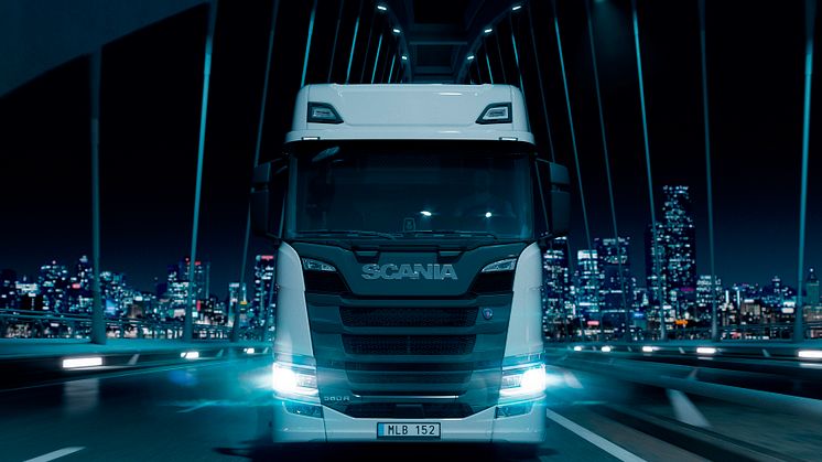 23104-003-Driving-truck-with-city-background