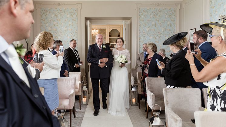 ​Rochdale stroke survivor walks daughter down the aisle after being left paralysed