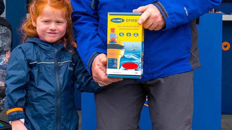 Hi-res image - Ocean Signal - A show visitor and his grand-daughter won the Ocean Signal rescueME EPIRB1 in the RNLI’s ‘Crack the Code Safe’ giveaway at Southampton Boat Show