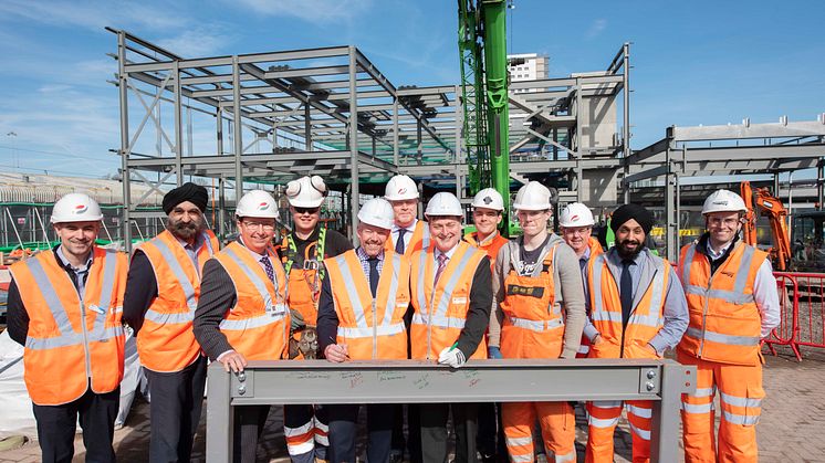 Wolverhampton Interchange partners and apprentices sign one of the steels to be used in the construction of the new railway station building 