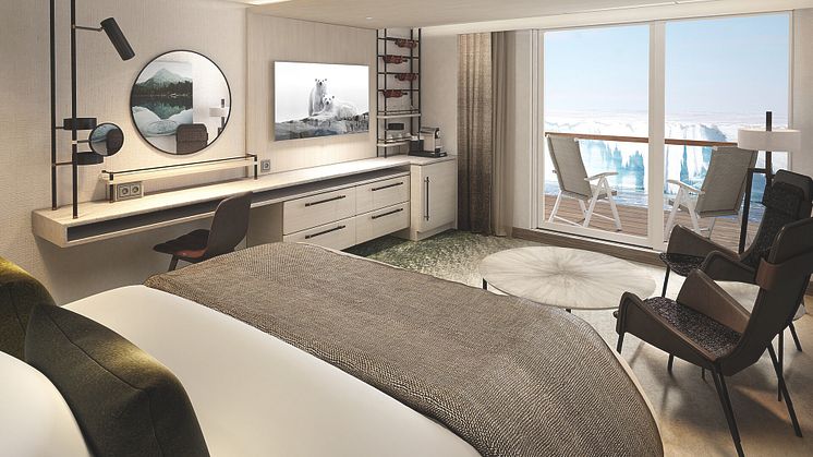 Ample workspace both inside the cabin or on the balcony onboard MS Roald Amundsen's Balcony Suites.