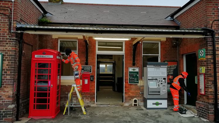 Workmen refurbish the street-level ticket hall