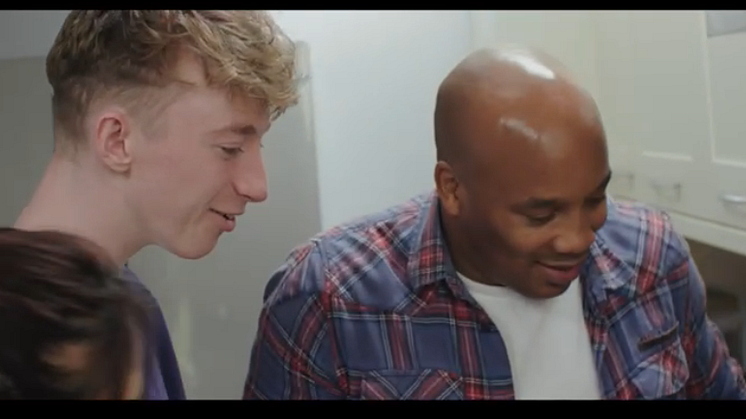 Screen shot from film, foster family spending time together
