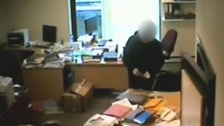 03 Still from covert footage inside the bugged accountant's office