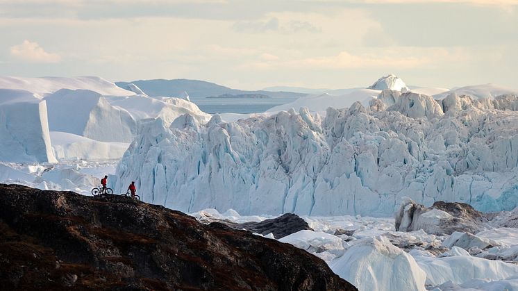 Ilulissat - Two Mountain Bikersat icefjord. Photo - Ben Haggar, Visit Greenland