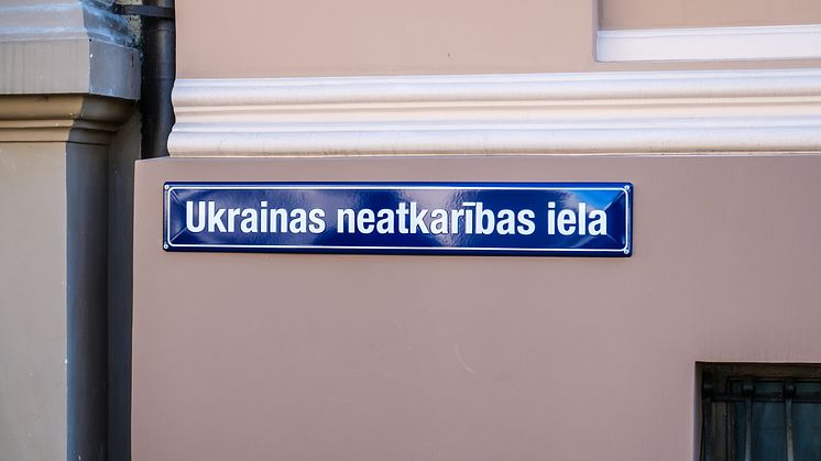 Street sign with the inscription Ukrainian Independence Street in the center of Riga. Shutterstock