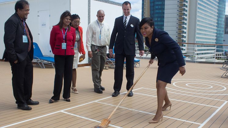 The Minister of Tourism for Trinidad and Tobago, the Honourable Shamfa Ashaki Cudjoe, tries her hand at deck shuffleboard during a tour of Fred. Olsen's 'Balmoral' on her maiden call at the Port of Spain, Trinidad on 15th November 2017. 
