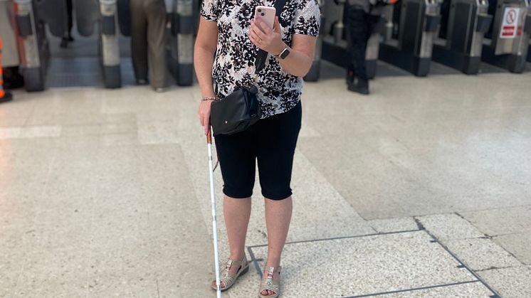 Linn Davies makes contact with an agent on the Aira app at Brighton station