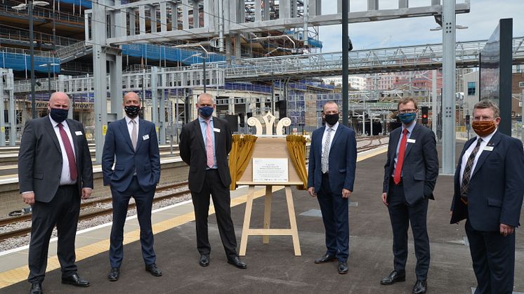 Thameslink and Great Northern MD Tom Moran (second from left) joins Network Rail's Route MD Rob Mackintosh and Rail Minister Chris Heaton-Harris (either side of the unveiled plaque) and other train company MDs at King's Cross on Monday