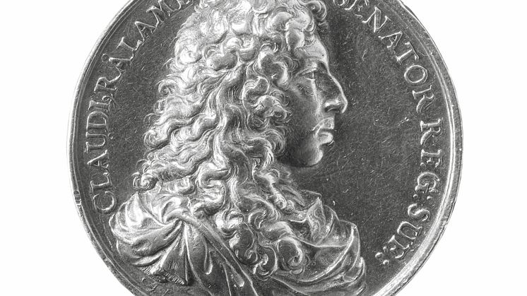 Silver coin portraying founder Claes Rålamb