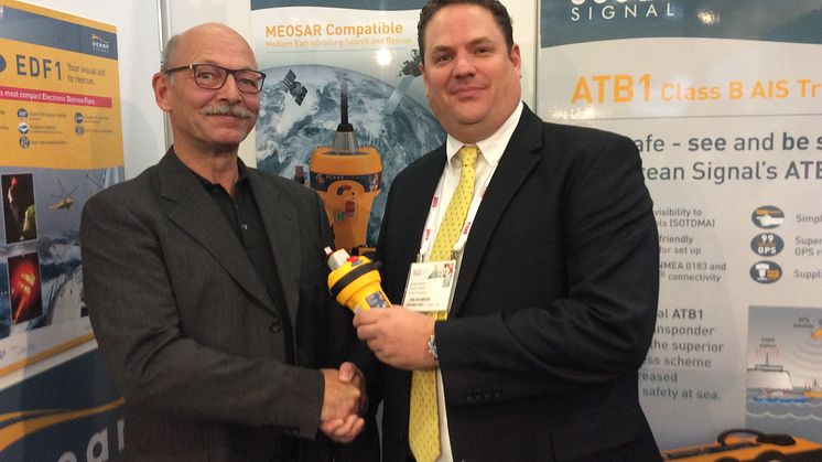 Hi-res image - Ocean Signal - Niko Reisch, Managing Director, Nordwest-Funk (left) with James Hewitt, Sales and Marketing Manager, Ocean Signal, at METSTRADE yesterday on the Ocean Signal Stand 03.125