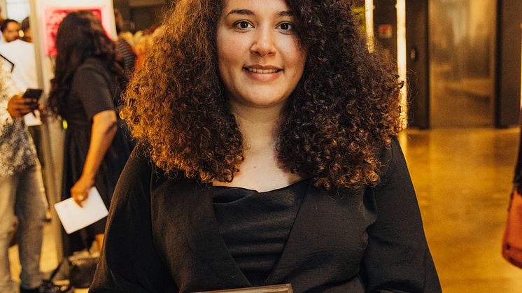 Levi Warren-Howard with her Culture & Heritage Award