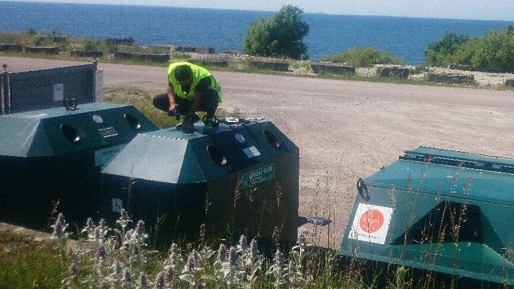 Mounting of transponders on glass recycling containers in Sweden.