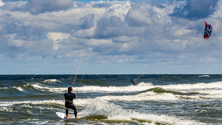 Kite surfers can increase their chance of rescue in an emergency by carrying a Personal Locator Beacon (PLB).                 Credit: Photo by Daniel Hajdacki on Unsplash 
