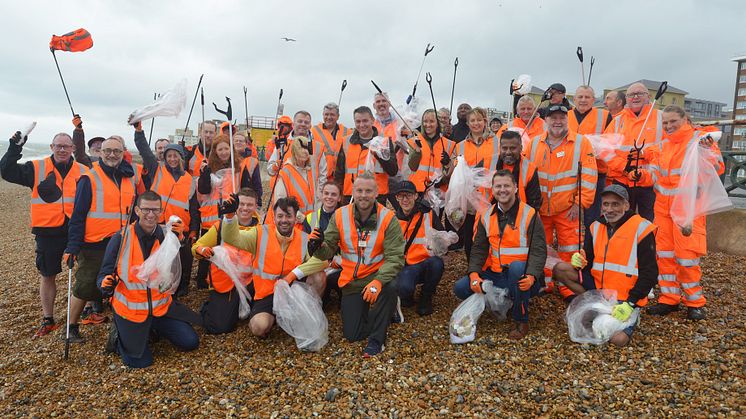 Soaking but happy with a job well done: GTR's Head of Environment Jason Brooker (centre) and the team at Brighton & Hove beach