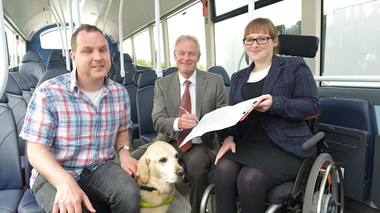 Bus user Angus Huntley and his guide dog Kira with Kevin Carr from Go North East and RNIB's Fran Di Giorgio