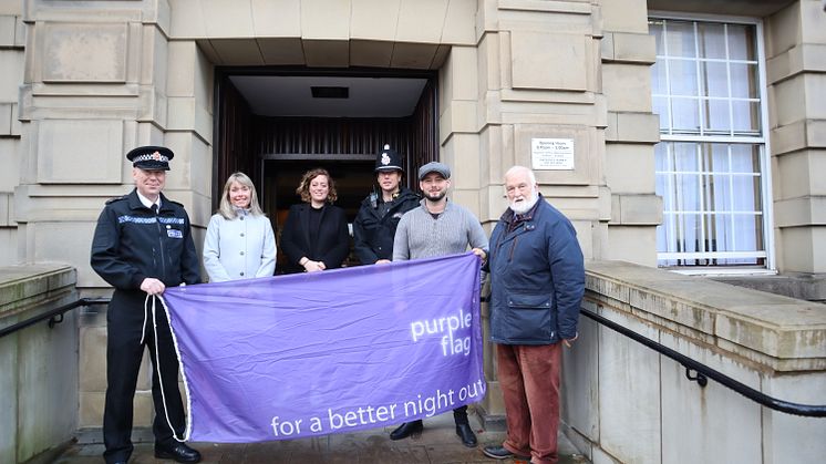 Raising the Purple Flag again (from left) Chief Inspector Jamie Collins (neighbourhoods, Bury North Command area); Victoria Robinson; Cllr Charlotte Morris; Sgt Martyn Bannister; Tom Sharman, chair of Bury Pubwatch and owner of House of Bridget/Eleph