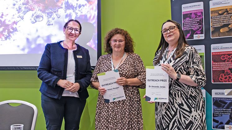 General Secretary of the Microbiology Society, Professor Karen Robinson, presents Dr Helen Hooper and Dr Amanda Jones from Northumbria University with the 2024 Microbiology Society Outreach Prize. Photo: Courtesy of the Microbiology Society