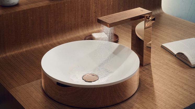 AXOR Suite round washbasin encased in polished red gold