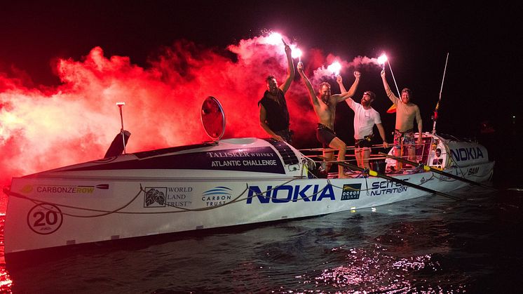 Carbon Zerow, sponsored by Ocean Signal, celebrate after finishing the 2017/18 Talisker Whisky Atlantic Challenge. Credit: Ted Martin