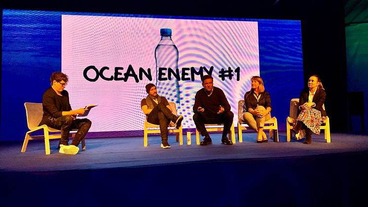 Bluewater Founder and CEO Bengt Rittri (center) explains how Bluewater has put ending the need for single use plastic bottles at the core of its business mission