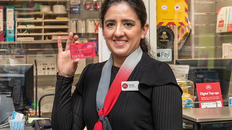 Postmistress Waheeda Akram with Drop & Go card