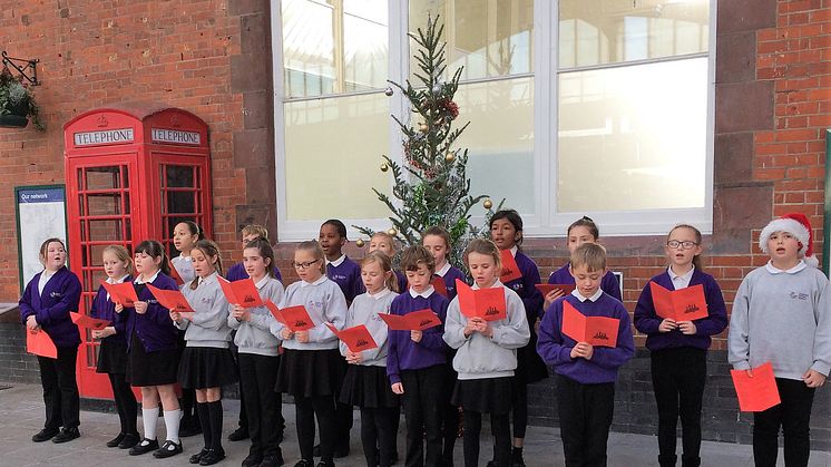 Southway Primary School children sang at Bognor Regis station.