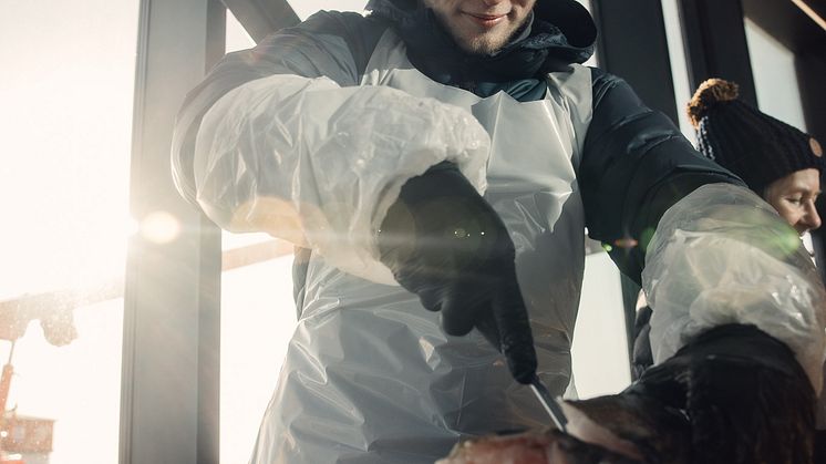 Sam Dixon YNCOTY winner tests his filleting skills on a skrei_photo credit- Norwegian Seafood Council_Kristoffer Lorentzen