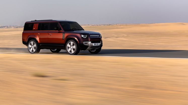 JLR_Reimagine_Product_DEFENDER_130_SEDONA_RED_DUBAI_ON-ROAD_090323_02